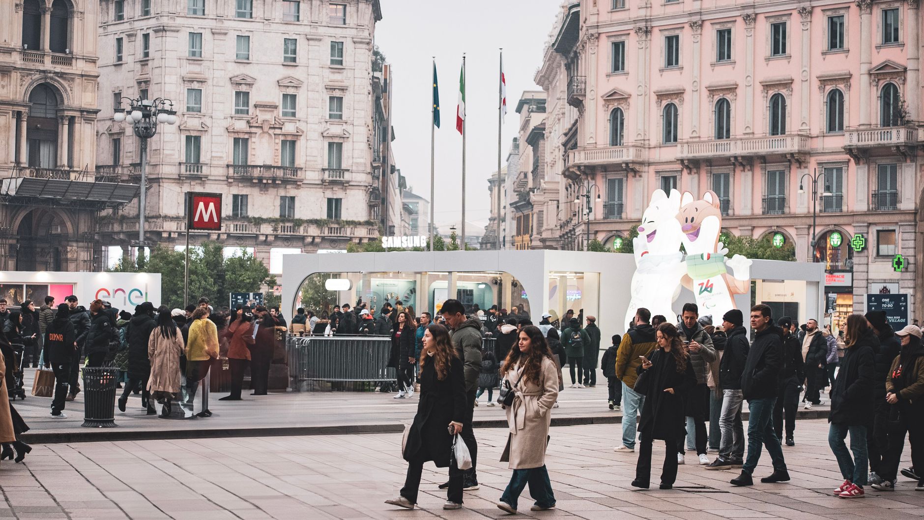 A bustling scene in Milan's historic district with people enjoying outdoor activities in Piazza during winter. — Coronavirus
